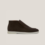 A dark brown suede loafer boot with a white sole.