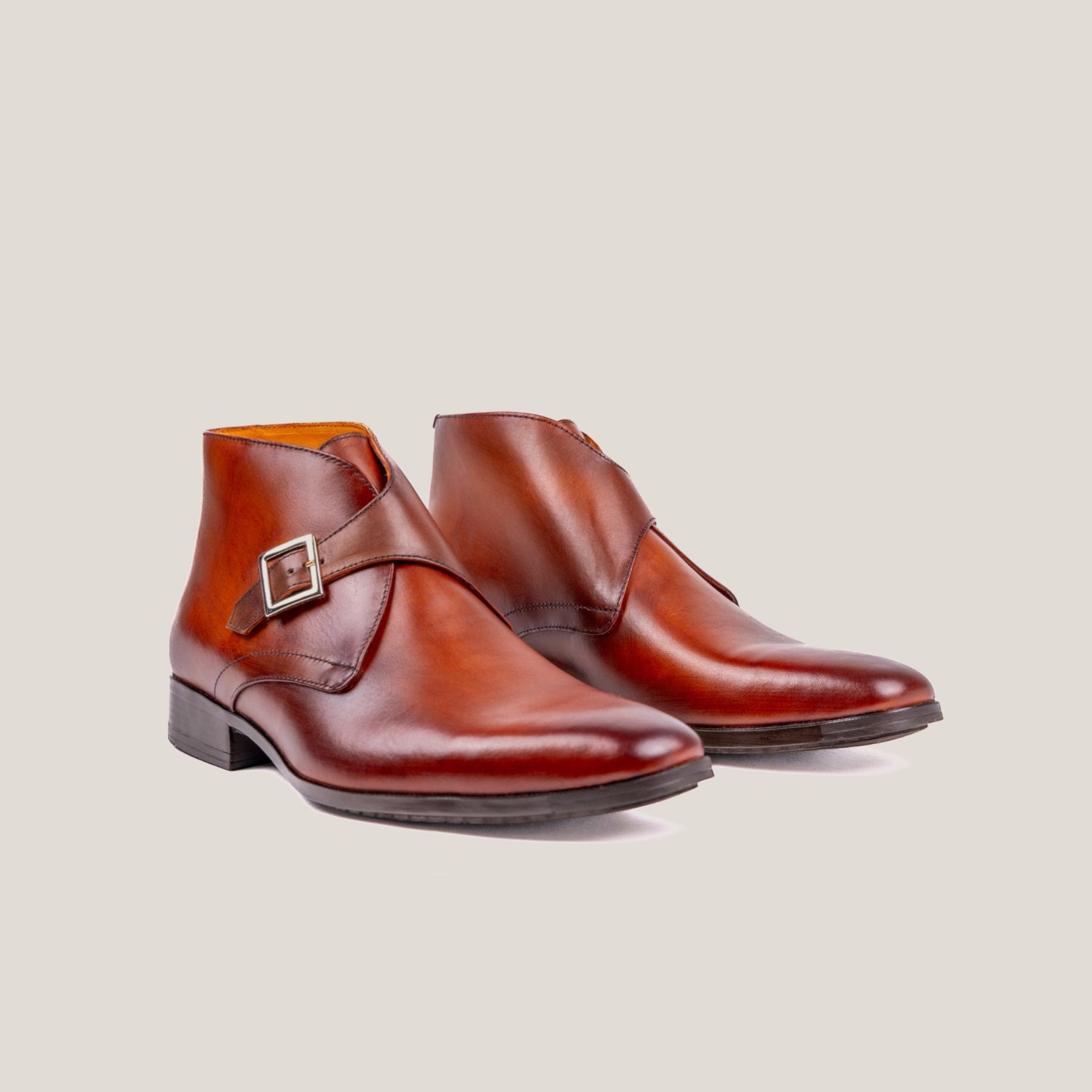 Reinhard Frans Stockholm light cognac brown leather monk strap boots with silver buckle detail.