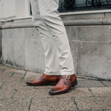 Reinhard Frans Stockholm light cognac brown leather monk strap boots with silver buckle.