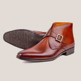 Reinhard Frans Stockholm cognac brown leather monk strap boots with silver buckle detail.