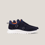 Navy blue shoes with white soles on a light gray background